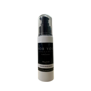 Hand and body lotion bottle with black and white label on a white background